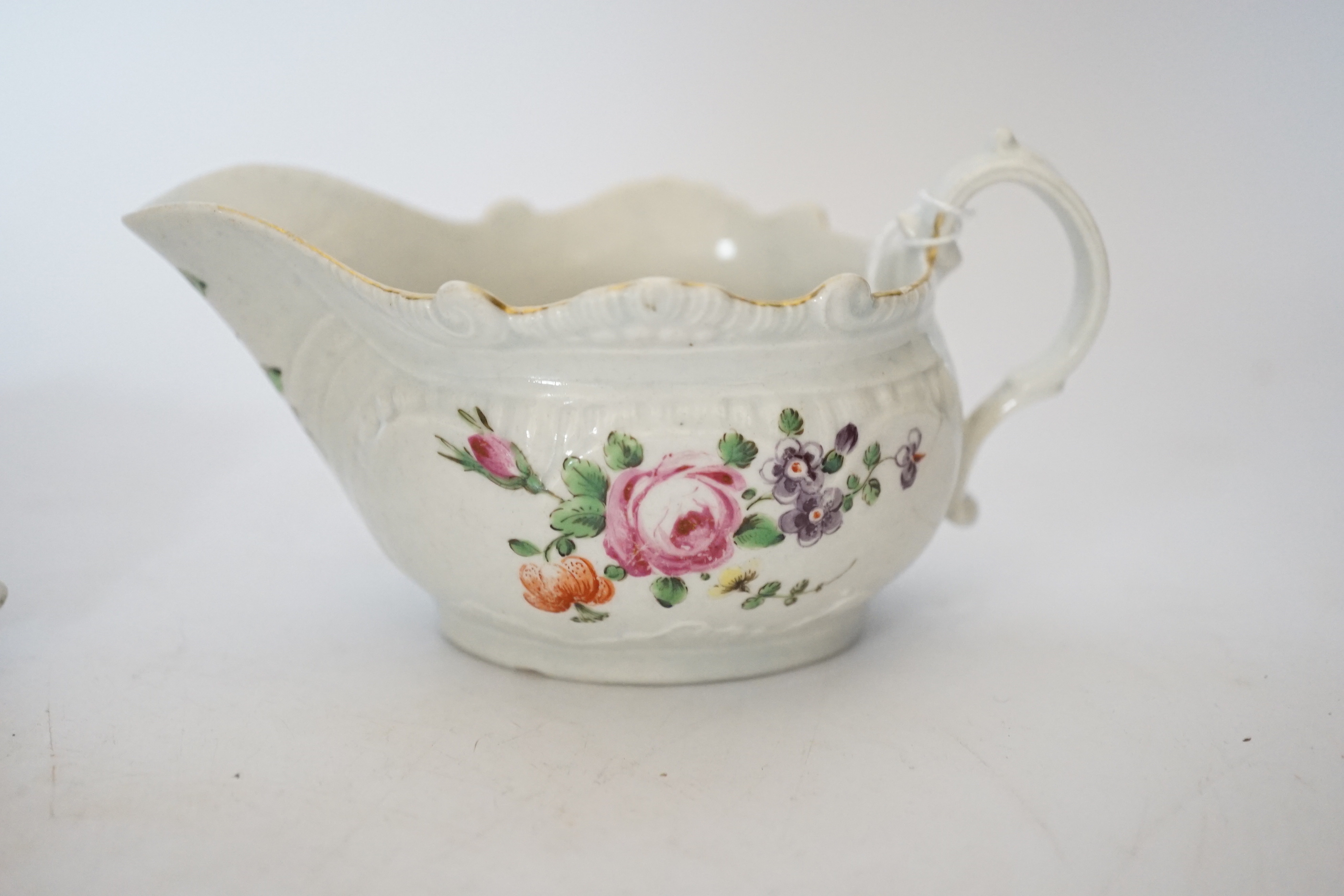 A Chaffers Liverpool saucer, c.1760 and two 18th century Christian or Pennington sauceboats, saucer 12cm diameter